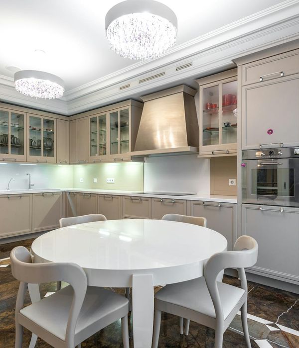 Luxury modern kitchen with white cabinets and marble countertops