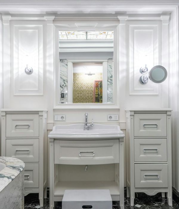 Sophisticated bathroom with marble tiles premium fixtures and mirror